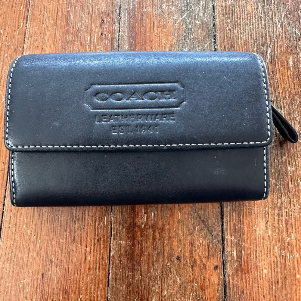 COACH Black Leatherette Continental Wallet with Embossed Logo.